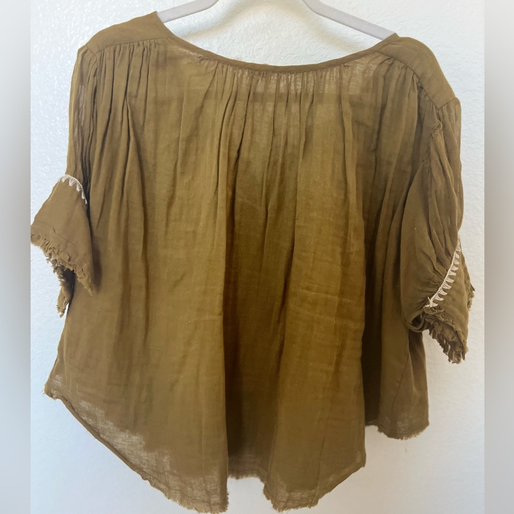 Free people tunic blouse in olive green.
